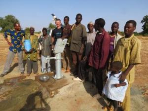 The new pump in Bourgou (with me wearing a t-shirt reminding me of my past life in Allstate!)