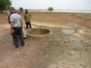 Hand dug well outside Piela - the height of the wall is an accident waiting to happen
